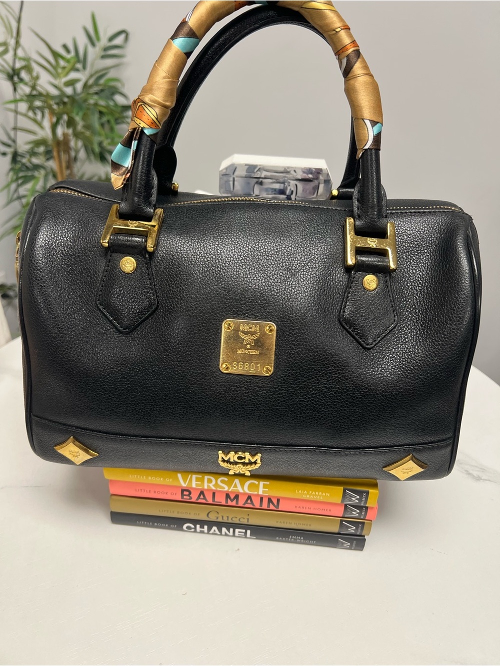MCM Black Leather boston with Gold Plaque